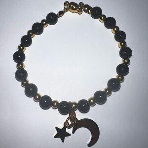 Handmade glass bead bracelet black and gold.